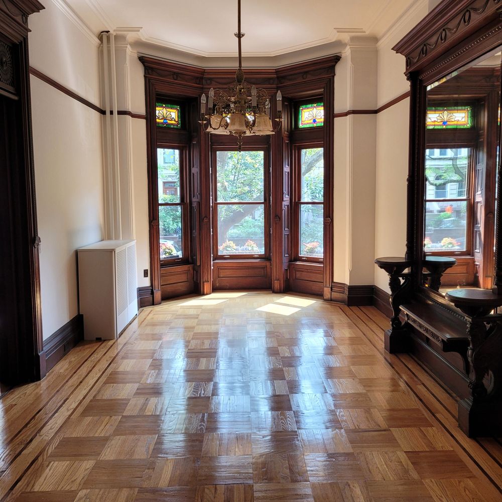 Herringbone pattern hardwood flooring in American luxury dining room